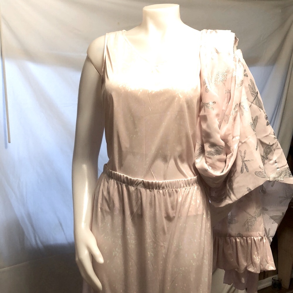 A sample, never worn. Petal Pink with shimmer. Worn out or as lingerie